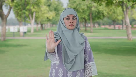 angry muslim woman asking to stop in park