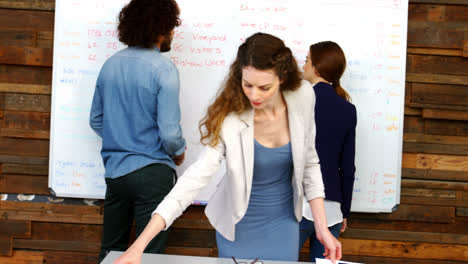 female executive looking at documents in the conference room