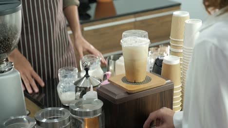 man in take away coffee shop with a cup of hot coffee in the morning