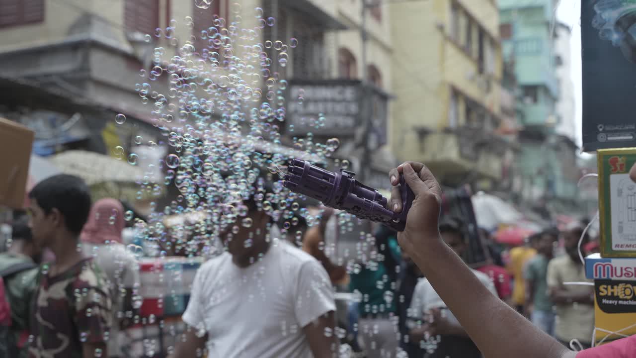 Bubble Gun on a Busy South Asian Street