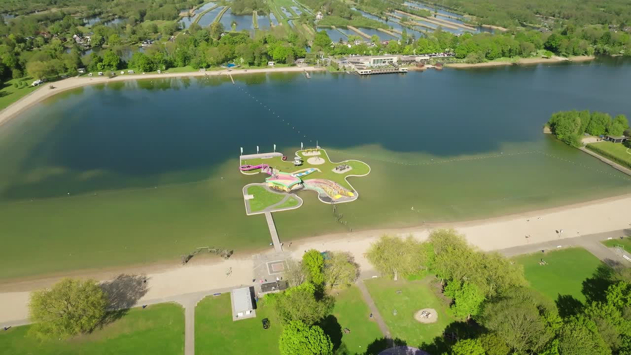 Big floating playground island on lake, summer activity attraction for holiday period