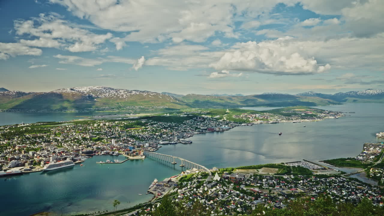Time lapse of Tromso, Norway from a high viewpoint.
High view of the nordic city, the landscape and the beautiful Norwegian fjords.