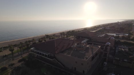 Aerial-view-of-tourist-resort-Islantilla-along-Atlantic-coastline,-sandy-beaches-and-scenery-of-natural-beauty