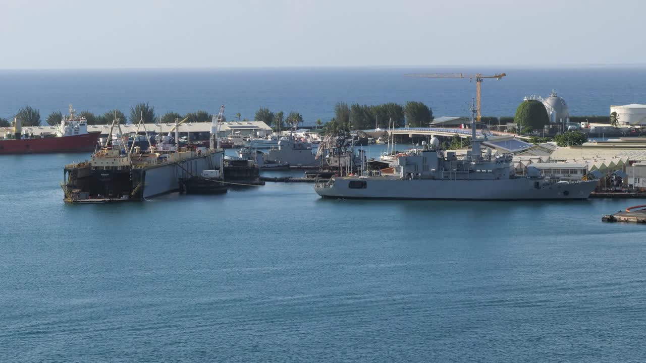 Port of Papeete,Tahiti, French Polynesia. French frigate warship docked in the port. Ship in dry dock.