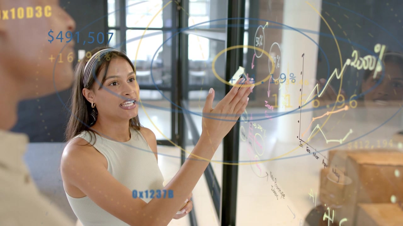 Woman starting to speak, pointing and tracing upward graph on glass, showing metric growth to peer
