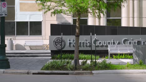 establishing shot of the harris county criminal justice center in houston, texas