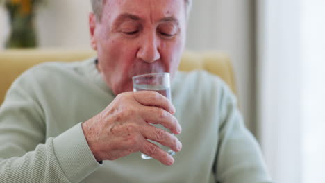 senior man, drinking water and parkinson disease