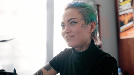 woman with colorful hair and tattoos