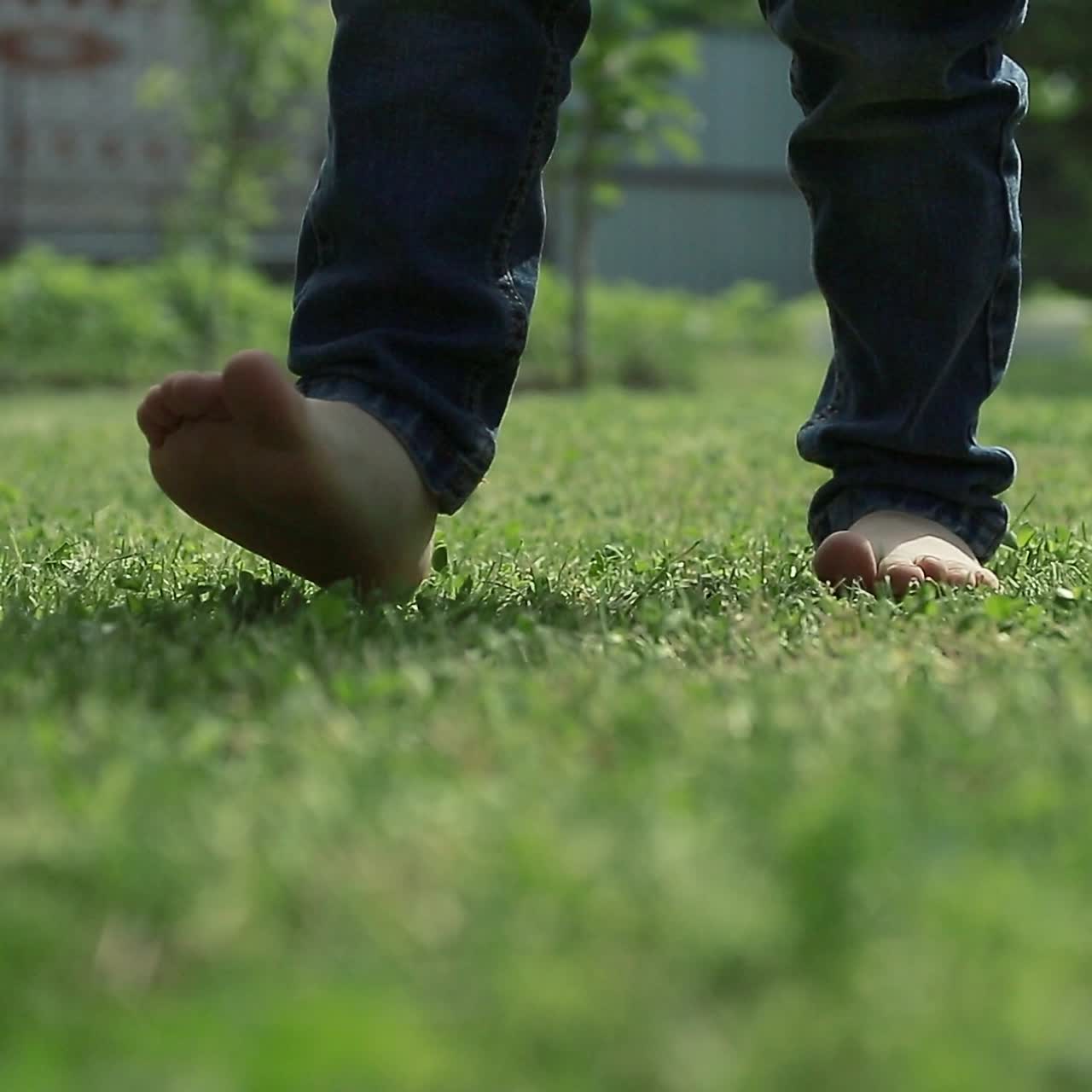 Happy Kid Jumping In Green Field