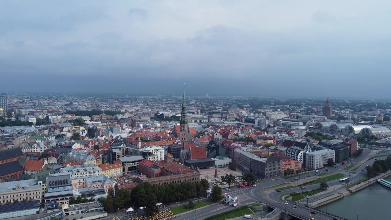 Moody sky above oldtown of Riga city, aerial drone view