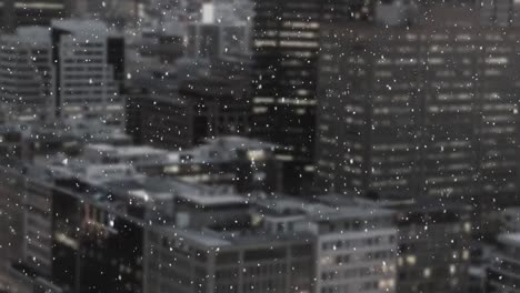 Snow-falling-and-cityscape
