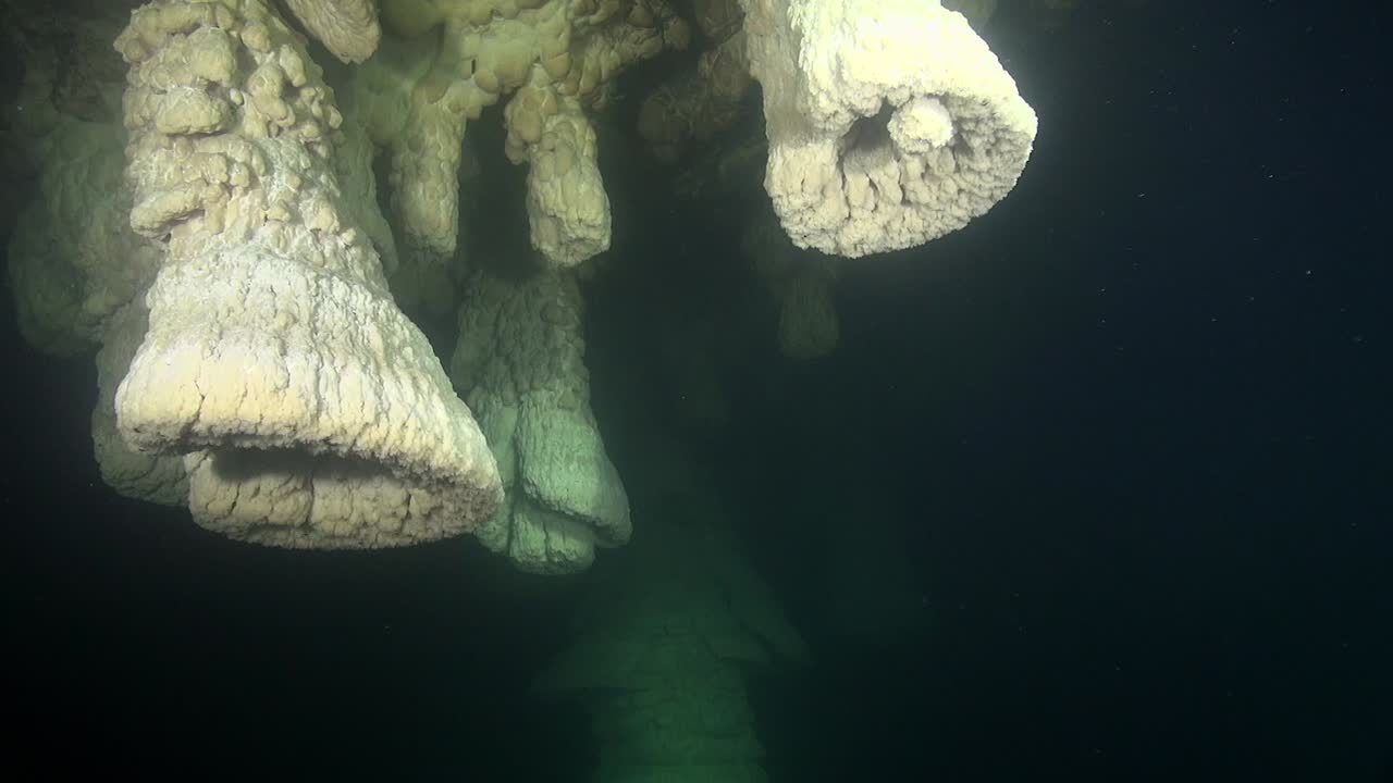 Light sweeps across unique bell speleothems