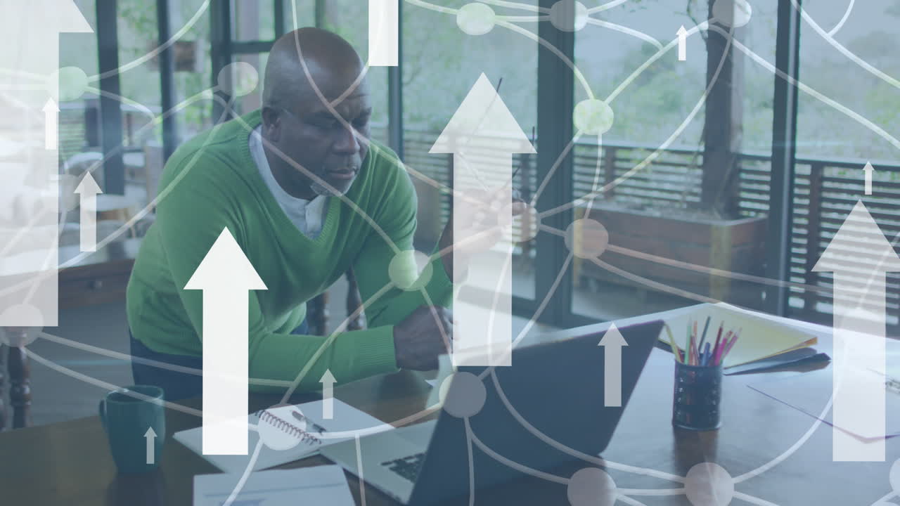 Animation of white arrows and connections over businessman using laptop