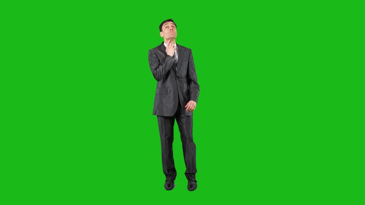Man in Suit Reacting and Pondering on Green Screen