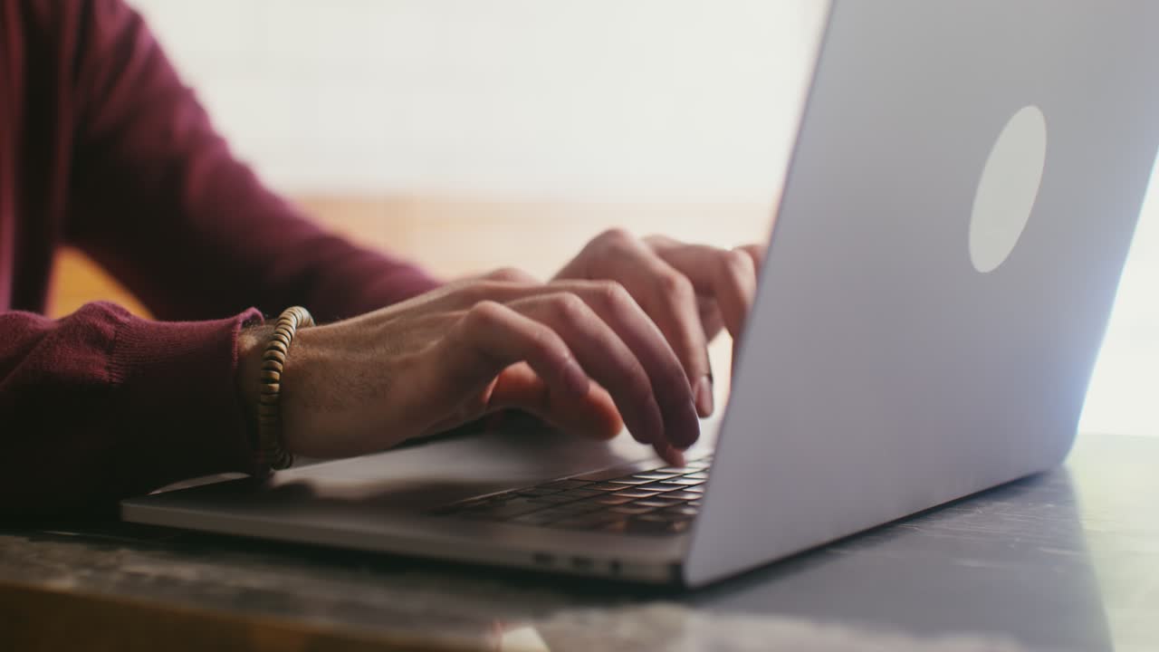 Person typing on a laptop