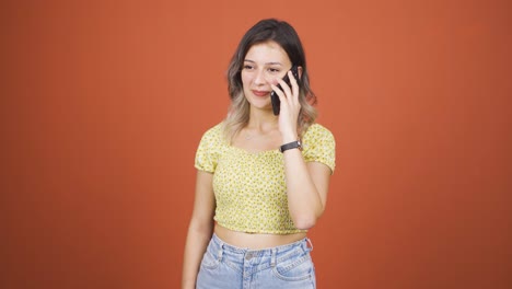 happy talking young woman on the phone.