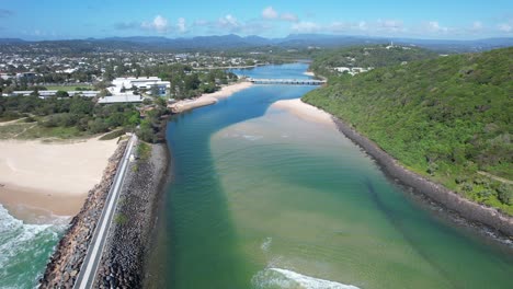 Pullback-Above-Tallebudgera-Creek-Revealing-Tallebudgera-Seawall-And-Burleigh-Headland-In-Queensland,-Australia