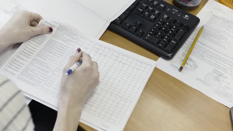 woman reviewing technical documents