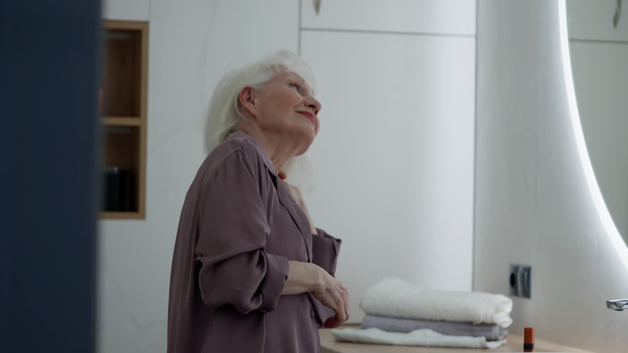 Elderly woman in bathroom