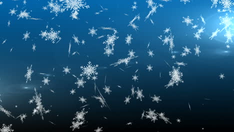 copos de nieve cayendo contra un fondo azul
