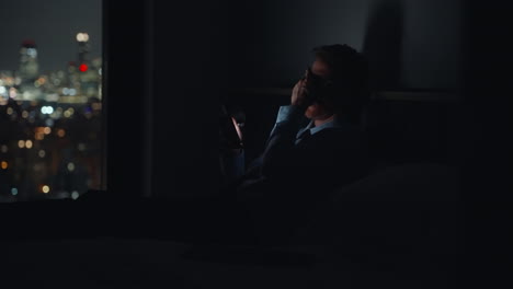 Tired-Businessman-texting-on-bed