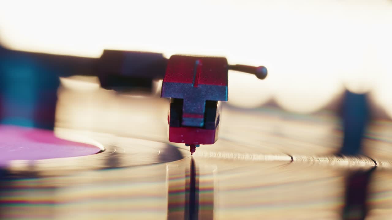 Close-Up of Record Player Stylus Playing Vinyl Record with Colorful Lights