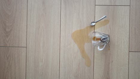 spilled coffee on a wooden floor