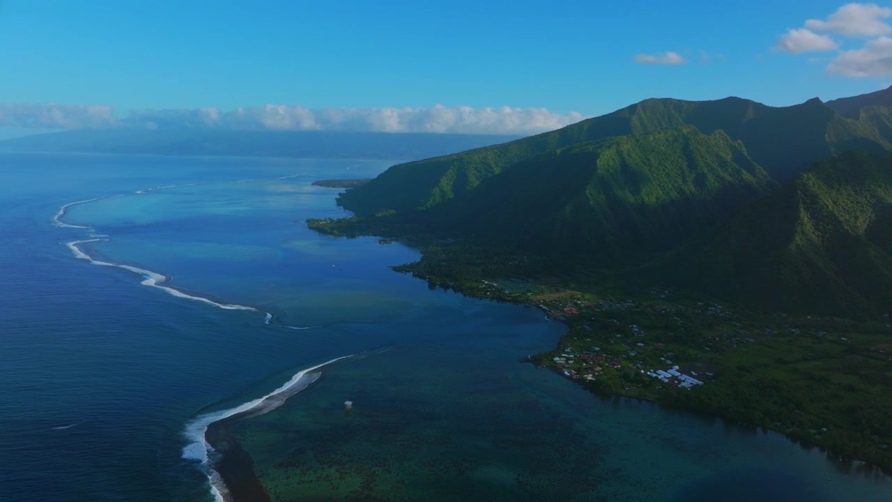 Teahupo'o wave surf spot coastline early morning Tahiti lagoon aerial drone harbor view French Polynesia Passe Havea vibrant coral reef South Pacific Ocean island landscape sunny Vaira'o circle left
