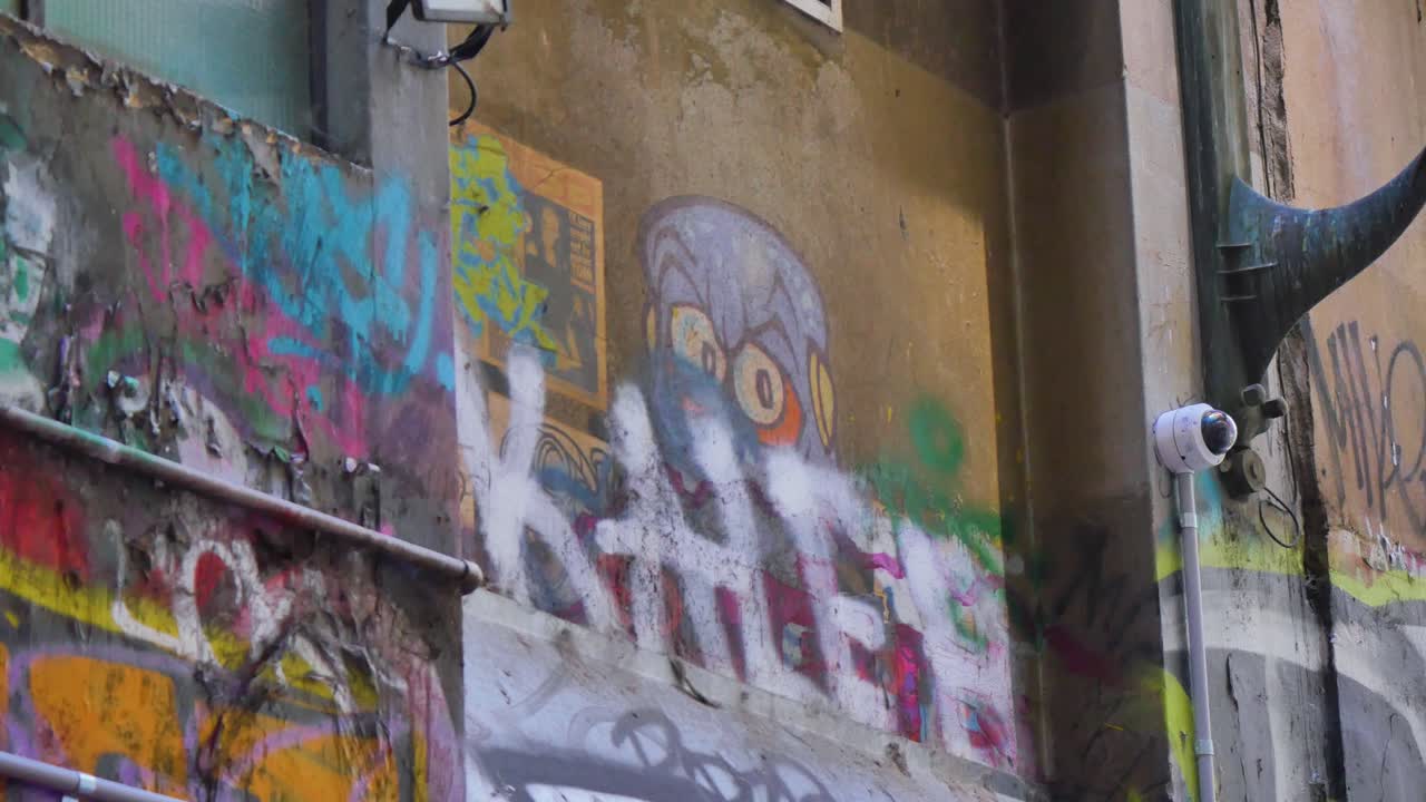 Spray painted street art in an alley