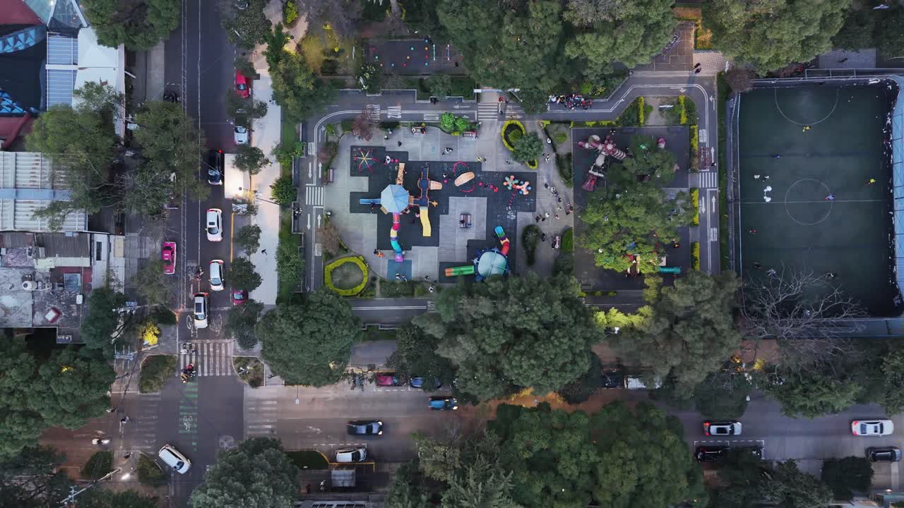 Aerial View of a City Park with Playground and Soccer Field
