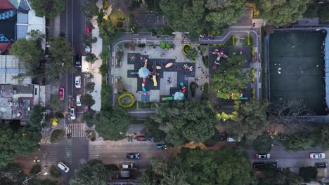 aerial view of a city park with playground and soccer field