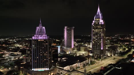 View-of-downtown-Mobile,-Alabama-at-night-with-drone-video-moving-in