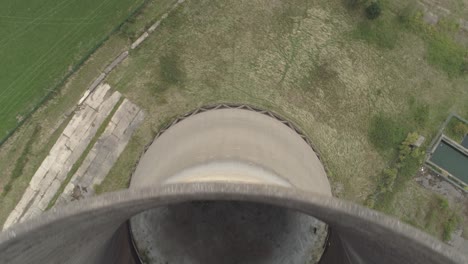 Birds-eye-view-aerial-shot-of-an-abandoned-cooling-tower-at-Willington-Power-station