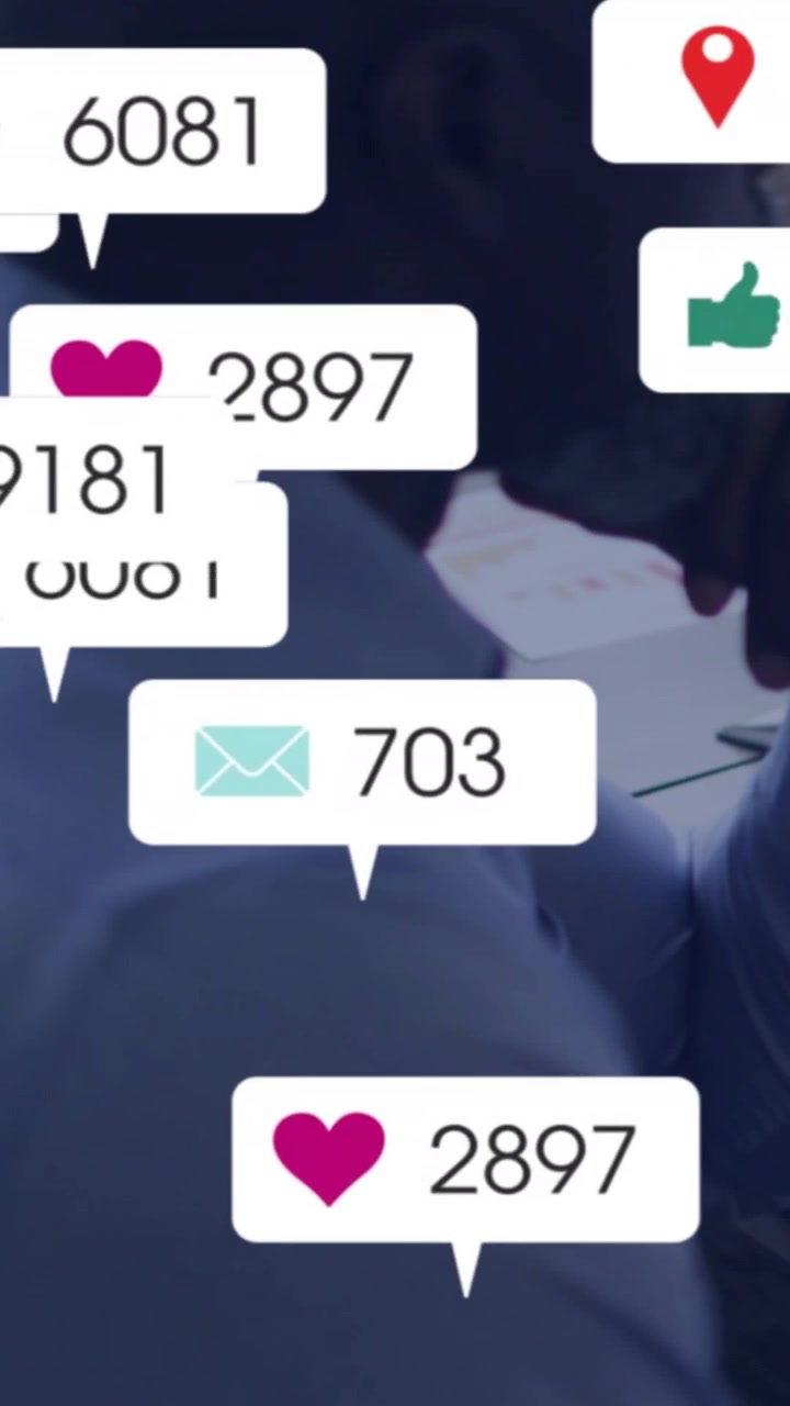 Vertical video: Man resting chin at desk, incoming social media bubbles flooding face then receding