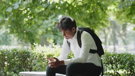 Young-man-in-a-white-shirt-is-thoughtfully