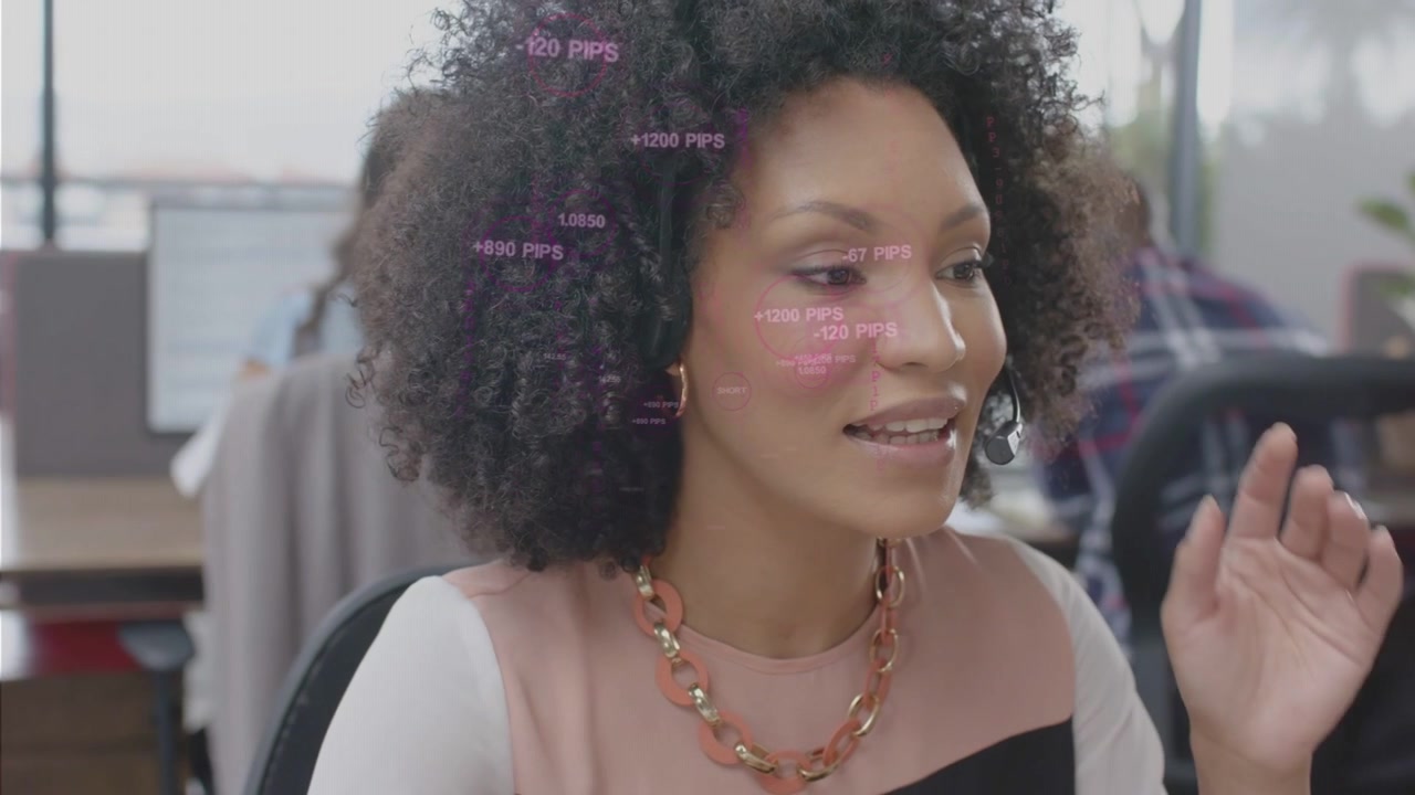 Customer-service woman glancing at monitor then fitting headset and joining call, pink HUD floating