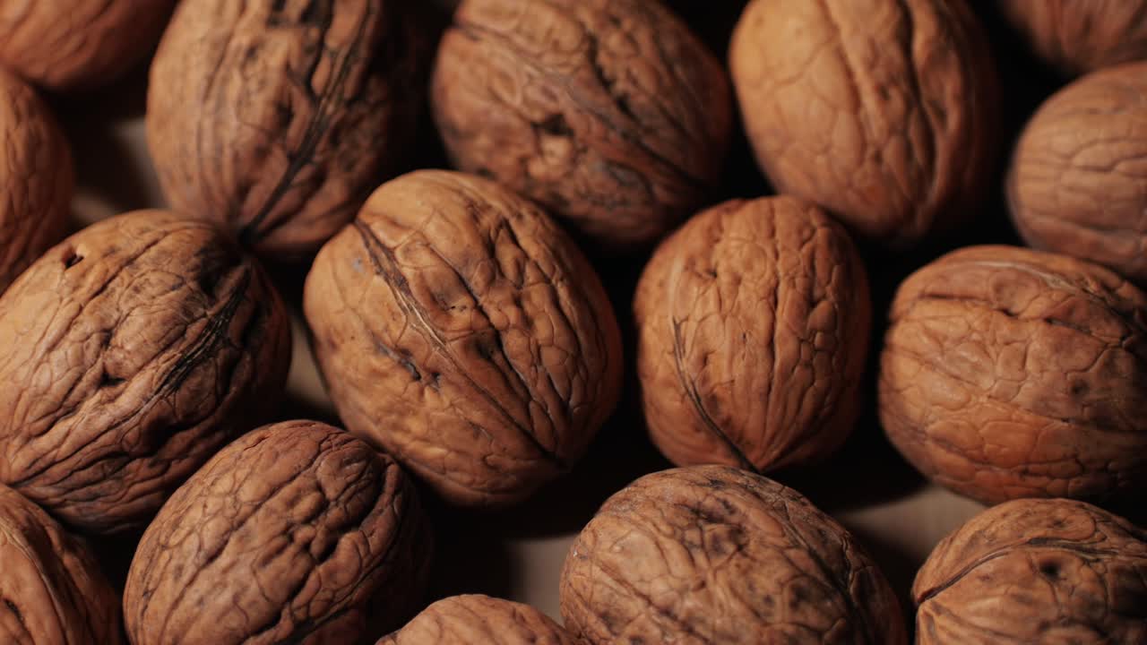 Walnuts in a shell top view. Healthy snacks. Product rich in minerals and vitamins. High quality 4k footage