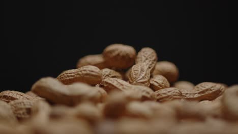 Spinning-pile-of-peanuts-with-black-background-2