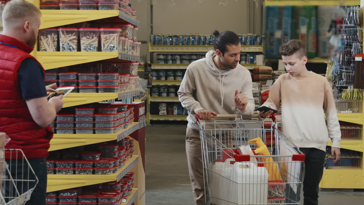 Man and Boy Shopping for Home Improvement Supplies