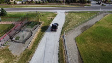 tracking a gravel path while a truck passes.