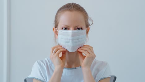 woman putting on a face mask