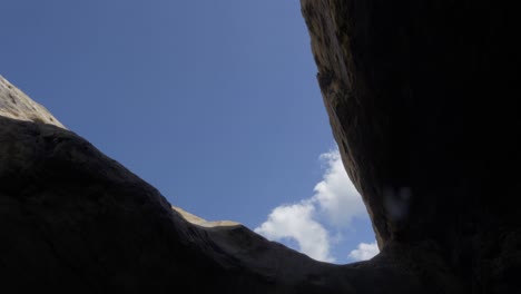 view to the sky out of a cave