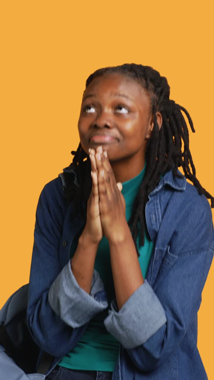 African American Woman Praying with Hopeful Expression