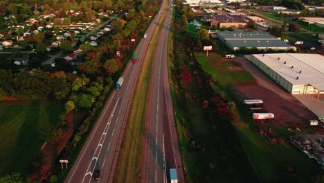 aerial view of interstate highway, capturing semi trucks in motion, commercial transport and logistics business