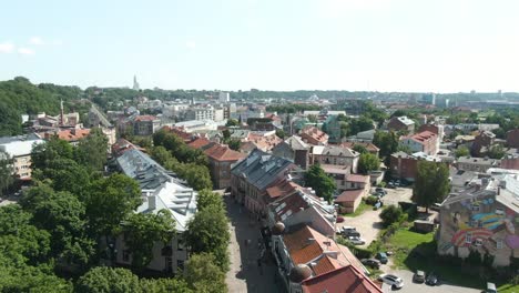 an aerial drone shot of kaunas city center main pedestrian street with drone camera is tilting downwards