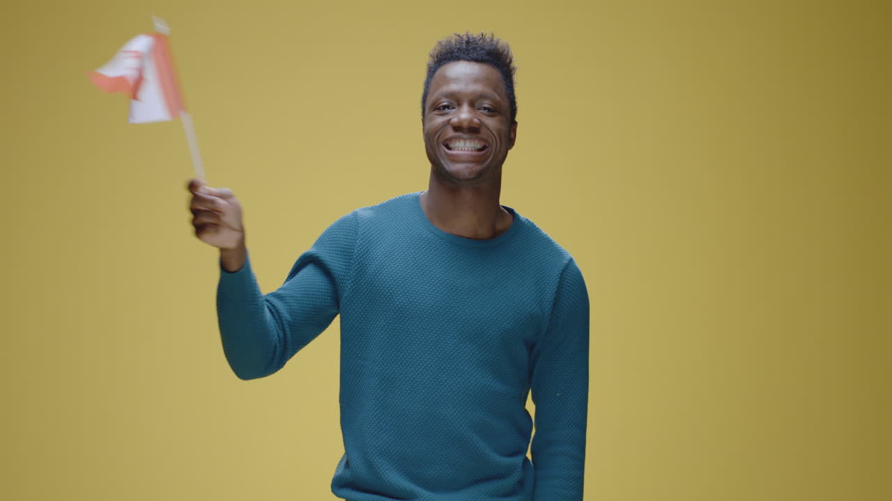Happy Man Waving Canadian Flag