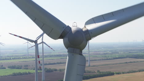 abstract close up aerial of a wind turbine with other turvbines in the background