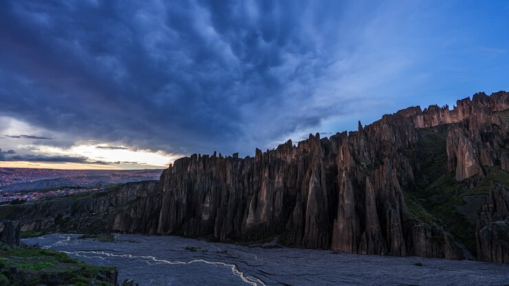 Time lapse scene of dramatic rock formations under colorful evening sky in Valle de las Animas, Bolivia, a unique and rugged geological landscape
