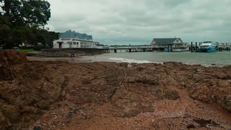 Slow-motion-wide-shot-of-Piahia-pier,-New-Zealand