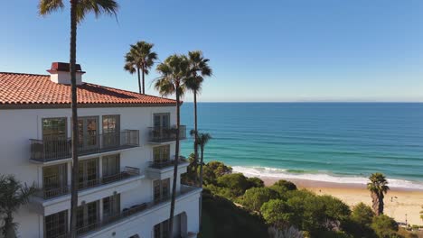 aerial view of ocean front luxury mansions on california coast